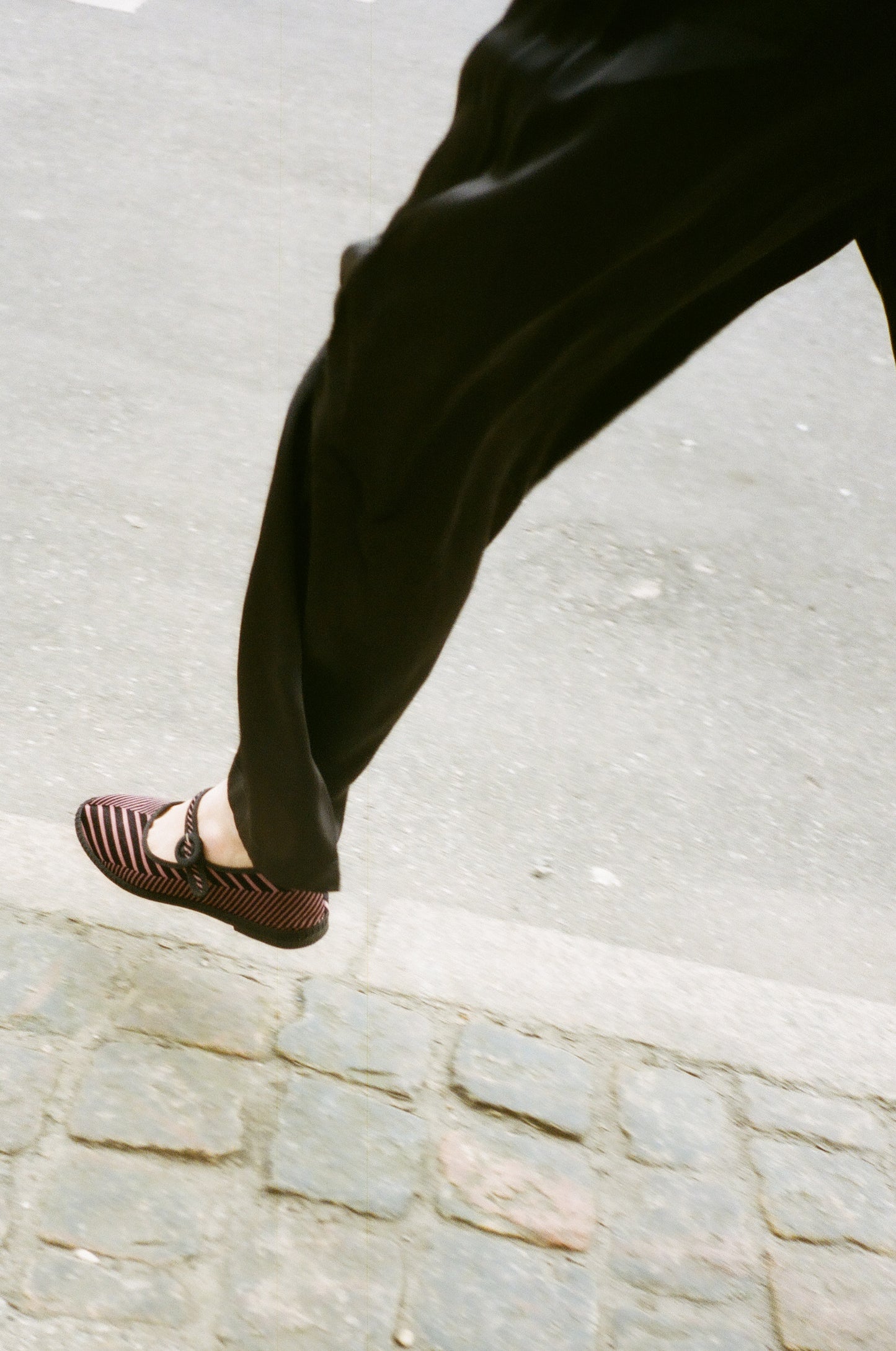 Limited edition Mary Janes made in collaboration with Ficus Folium. A take on a modern ballerina mixed with the classic features of a mary jane. The shoes have a flat sole with a small heel, a buckle closure over the foot, and a closed rounded toe. The shoes are handmade in Italy using traditional production techniques in carefully selected high-quality materials. Color: Black and pink zig-zag pattern Material: 100% silk velour Sole: 100% rubber sole
