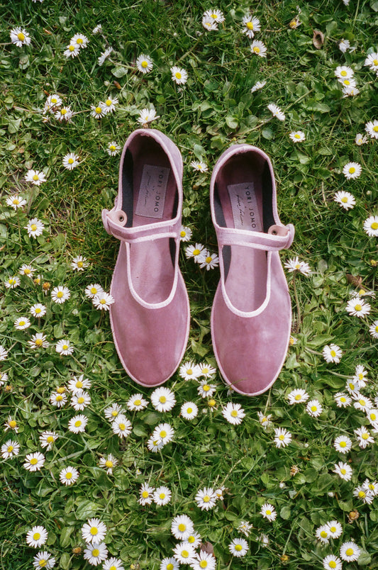 Limited edition Mary Janes made in collaboration with Ficus Folium.  A take on a modern ballerina mixed with the classic features of a Mary Jane. The shoes have a flat sole with a small heel, a buckle closure over the foot, and a closed rounded toe.  The shoes are handmade in Italy using traditional production techniques in carefully selected high-quality materials.  Color: Rose Material: 100% silk velour Sole: 100% rubber sole