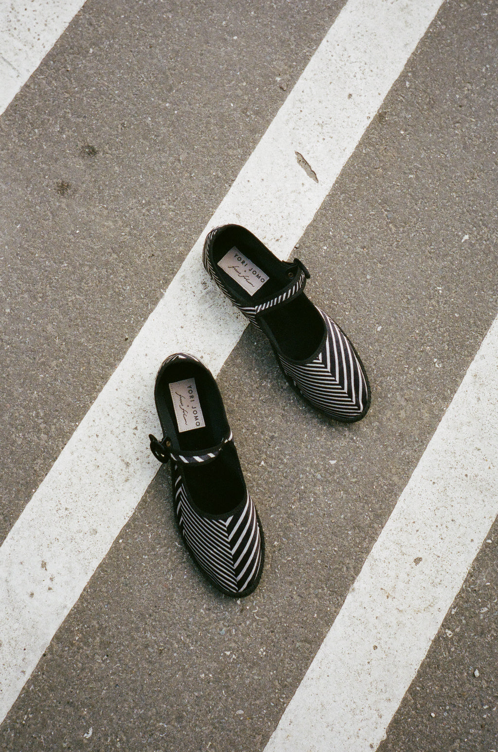 Limited edition Mary Janes made in collaboration with Ficus Folium.  A take on a modern ballerina mixed with the classic features of a mary jane. The shoes have a flat sole with a small heel, a buckle closure over the foot, and a closed rounded toe.  The shoes are handmade in Italy using traditional production techniques in carefully selected high-quality materials.  Color: Black and grey zig-zag pattern  Material: 100% silk velour Sole: 100% rubber sole